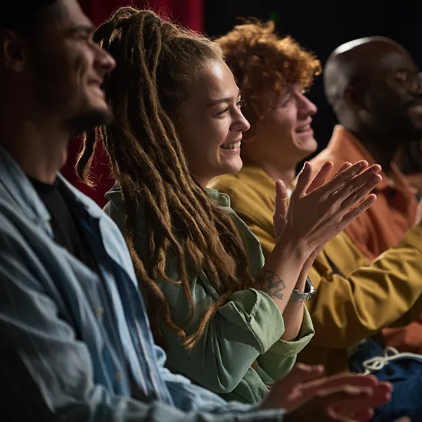 An audience applauds after watching Lygia perform